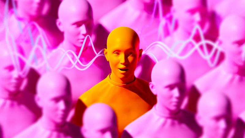 An image of pink human figures in a crowd. In the center is one orange human figure looking up and smiling as audio waves go through its ears.